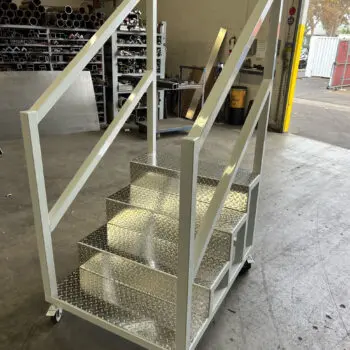 Portable metal steps on wheels