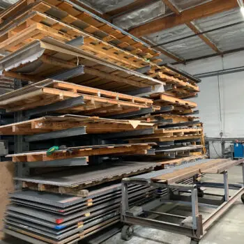 Metal sheets stacked on racks