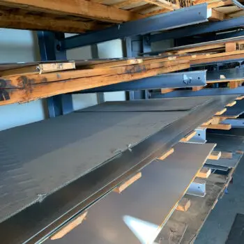 Metal sheets on wooden shelves