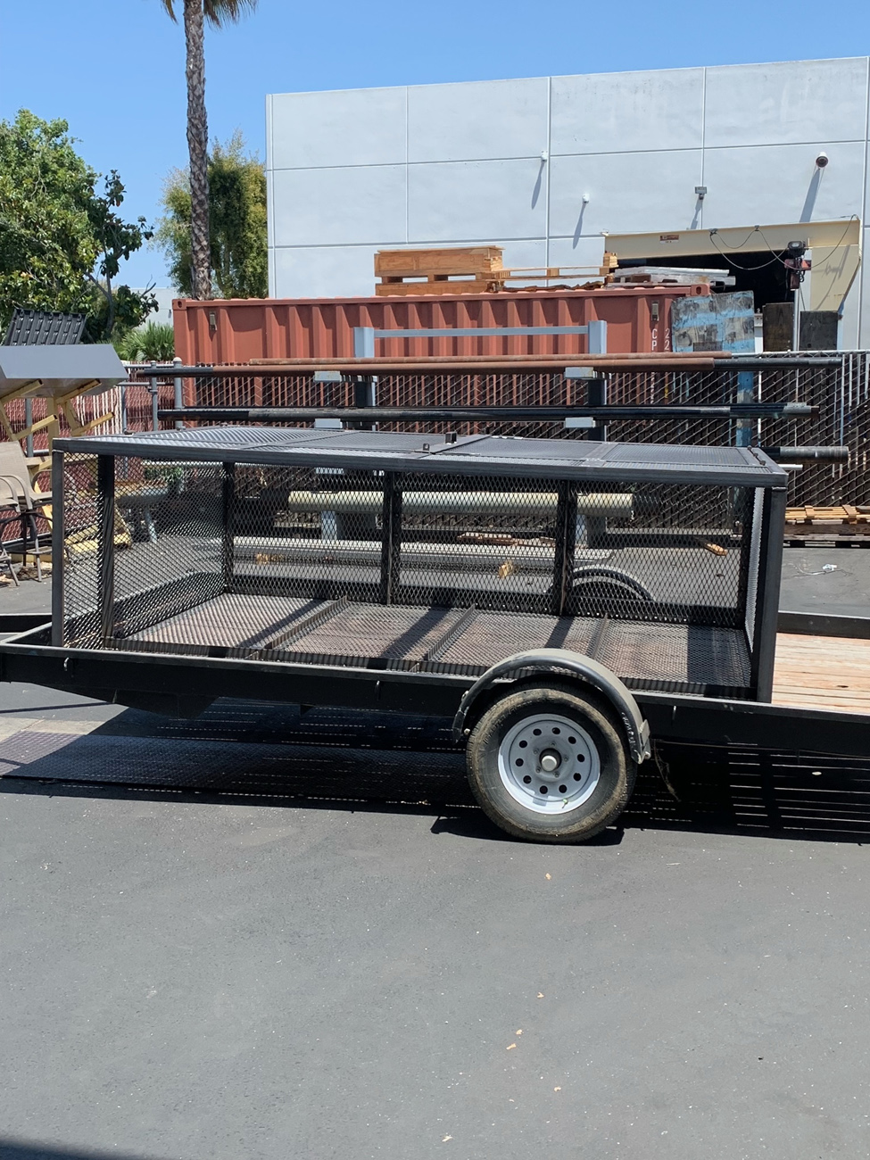 Metal trailer with mesh sides