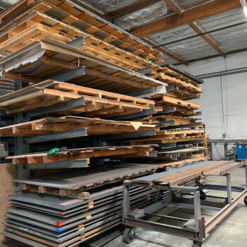 Metal sheets stacked on racks