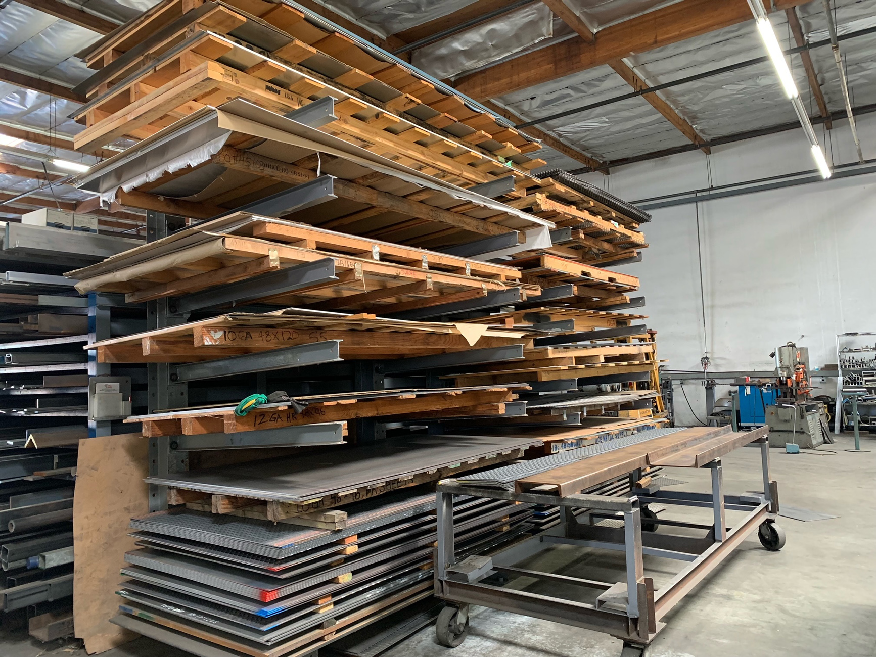 Metal sheets stacked on racks